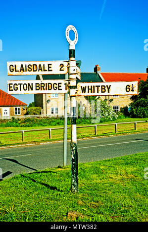 Road Junction signpost for Whitby and  Glaisdale, Egton, North Yorkshire Moors, England Stock Photo