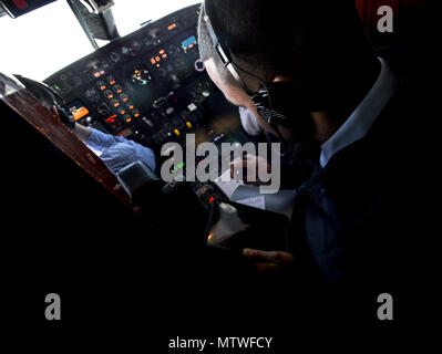 170130-F-WU507-002: Tech. Sgt. Vanessa Schook, 99th Airlift Squadron flight attendant, performs a pre-flight safety inspection on a C-20B at Joint Base Andrews, Maryland, Jan. 27, 2017. FAs are safety experts, customs specialists and culinary artists, often preparing meals from scratch at 30-to-40,000 feet, while ensuring the safety of the crew and passengers at all times. (U.S. Air Force photo by Senior Master Sgt. Kevin Wallace/RELEASED) Stock Photo