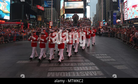 U.S. Marines with the “The Commandant’s Own,” United States Marine Drum & Bugle Corps, Marine Barracks Washington, D.C., perform for the crowds during a USMC Battle Colors Detachment Performance during Fleet Week New York in Times Square, New York, May 26, 2018. Now in its 30th year, Fleet Week  is the city’s time-honored celebration of the sea services. It is an unparalleled opportunity for the citizens of New York and the surrounding tri-state area to meet Marines, Sailors, and Coast Guardsmen, as well as witness firsthand the latest capabilities of today’s maritime services. (U.S. Marine Co Stock Photo
