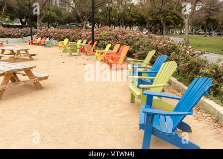 Colorful Adirondack chairs at Plaza de Cesar Chavez Park in Downtown San José, Silicon Valley, Northern California, USA. Stock Photo