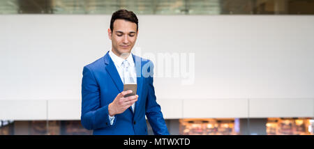 Businessman using his cellphone Stock Photo