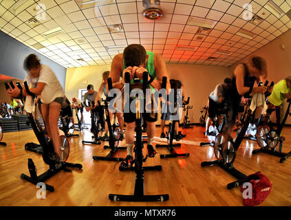 Members of Team Whiteman participate in the E-Cycle Blast Plus class at the fitness center on Whiteman Air Force Base, Mo., Jan. 30, 2017. The class challenges the upper and lower body with resistance, interval and flat ride training to a variety of music. The plus class includes an extra 15 minutes of core work at the end of the class. Stock Photo