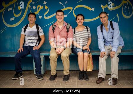 MANAMA, Bahrain (Jan. 11, 2017) U.S. Marines and Sailors with the Makin Island Amphibious Ready Group/11th Marine Expeditionary Unit take a break during a city tour in Manama, Bahrain, Jan. 11. The city tour includes a visit to a camel farm, the Al Fateh Grand Masque, Sweet Soque, Bahrain Fort, the Bahrain National Museum and an authentic Arabic lunch at Veranda Café. The tours provided by the USS Makin Island (LHD 8) Morale, Welfare and Recreation team enable the service members the opportunity to visit numerous venues around Bahrain during the Makin Island’s port visit. The Makin Island ARG/ Stock Photo