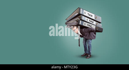 Man carrying a giant stack of tax folders Stock Photo