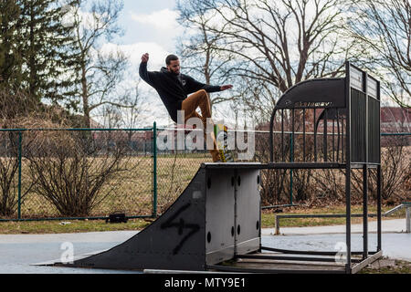 skateboarding at a small skate park Stock Photo