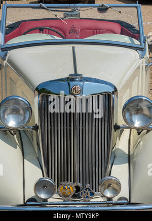 front view of a vintage MG sports car with headlights and radiator grille. Stock Photo