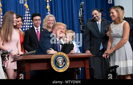 President Donald Trump, left, reacts as Washington Nationals catcher Kurt  Suzuki walks to a podium to speak during an event to honor the 2019 World  Series champion Nationals at the White House