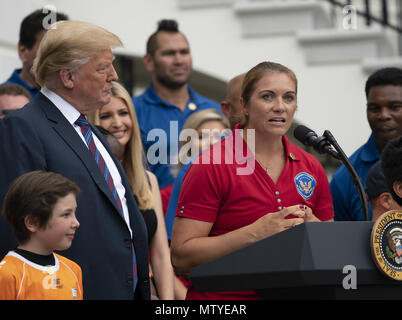 Washington, District of Columbia, USA. 30th May, 2018. United States president Donald J. Trump listens to retired Olympic Volleyball player Misty May-Treanor during the White House Sports and Fitness Day at the White House in Washington, DC, May 30, 2018. Credit: Chris Kleponis/CNP Credit: Chris Kleponis/CNP/ZUMA Wire/Alamy Live News Stock Photo