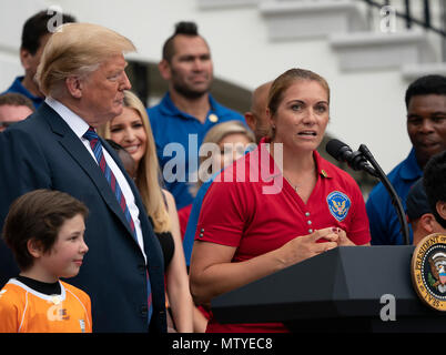 United States president Donald J. Trump listens to retired Olympic Volleyball player Misty May-Treanor during the White House Sports and Fitness Day at the White House in Washington, DC, May 30, 2018. Credit: Chris Kleponis/CNP | usage worldwide Stock Photo
