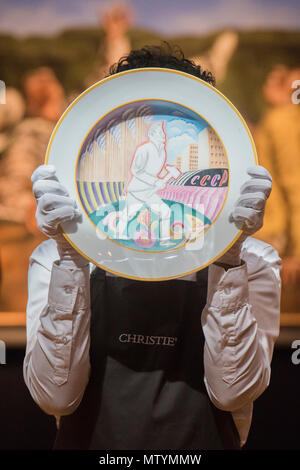 London, UK. 31st May, 2018. A Soviet porcelain propaganda platter, byt the Imperial Porcelain factory est £12-18000 - Christie's Russian Art highlights, King Street, London. Credit: Guy Bell/Alamy Live News Stock Photo