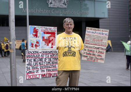 Manchester, Greater Manchester, UK. 22nd May, 2018. A protester outside the Manchester Civil Justice Centre to protest against the proposed injunction against anti-fracking protests at Cuadrilla's fracking site in Lancashire. Credit: Steven Speed/SOPA Images/ZUMA Wire/Alamy Live News Stock Photo
