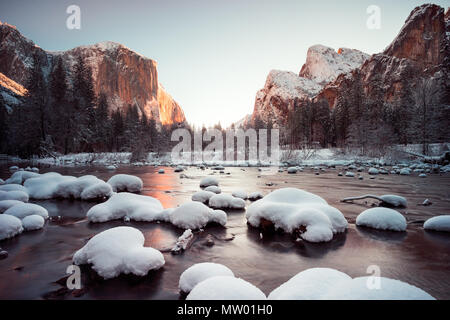Snow covered rocks in Merced river, Yosemite, California, United States Stock Photo