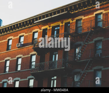 An apartment building on Christopher Street in Manhattan as the sun is starting to set Stock Photo