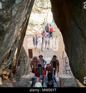 Group of tourists climb up Sigiriya Rock, Matale District, Sri Lanka Stock Photo