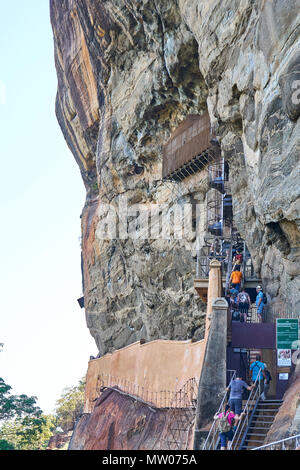 Group of tourists climb up Sigiriya Rock, Matale District, Sri Lanka Stock Photo