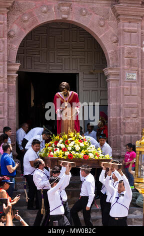 A statue of of JESUS on the pillar is carried down the steps of the SAN RAFAEL chapel during the Good Friday Procession called Santo Encuentro - SAN M Stock Photo