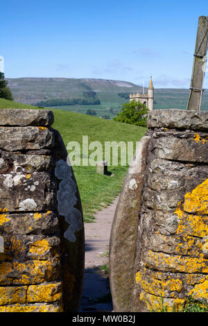 Gap stile on the Pennine Way approaching Hawes in the Yorkshire Dales National Park Stock Photo