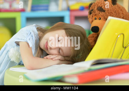 Tired schoolgirl sleeping Stock Photo