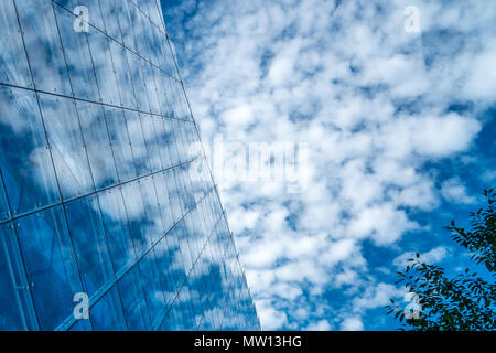 reflecting clouds on a galss facade cloudy Stock Photo