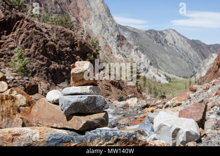 Rocks piled on the side of a trail in the Sierra Nevada Mountains, California. Stock Photo