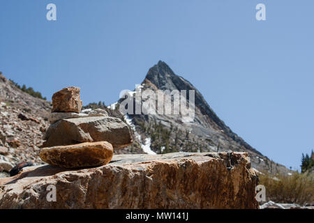 Rocks piled on the side of a trail in the Sierra Nevada Mountains, California. Stock Photo