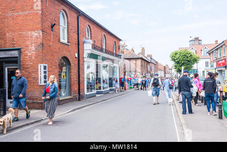 Wells-next-the-Sea, Norfolk, UK. 27th May 2018. People  and tourists walking along  Staithe Street on a sunny summer day in Wells-next-the-Sea Stock Photo