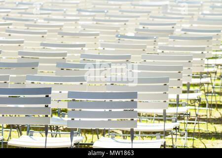 White chair rows in a spa park in medium light Stock Photo