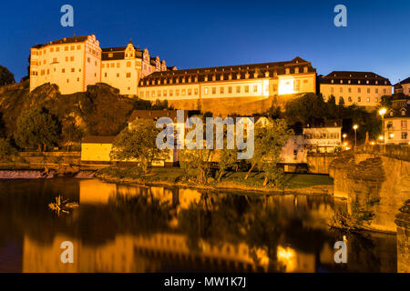 Weilburg Castle, reflection in the river Lahn, at night, Weilburg an der Lahn, Hesse, Germany Stock Photo