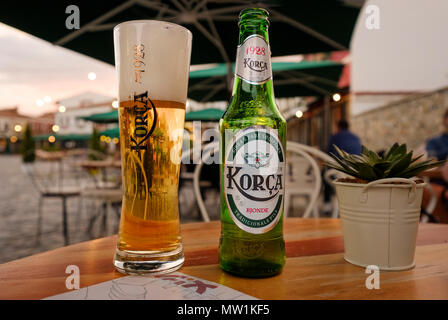 Beer glass and beer bottle on table, Korca beer, Korca, Korça, Albania Stock Photo