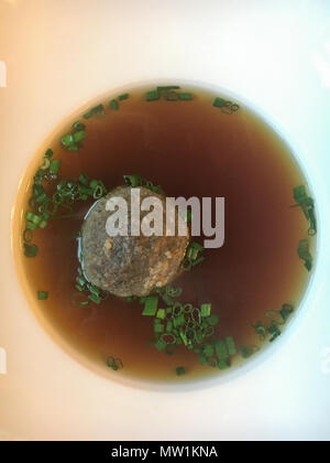 Traditional Bavarian soup with liver dumpling and chives Stock Photo