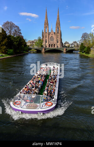 Tourist boat on river Ill with St. Paul's Church, Strasbourg, Alsace, France Stock Photo