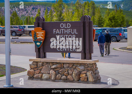 YELLOWSTONE, MONTANA, USA MAY 24, 2018: Close up of informative sign of old faithful education center written over a wooden structure of Yellowstone National Park Stock Photo