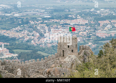 Portuguese flag flying atop Moorish Castle in Sintra, Portugal. Stock Photo