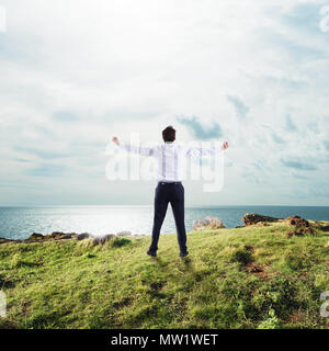 Businessman with open arms to the sky. concept of success and freedom Stock Photo
