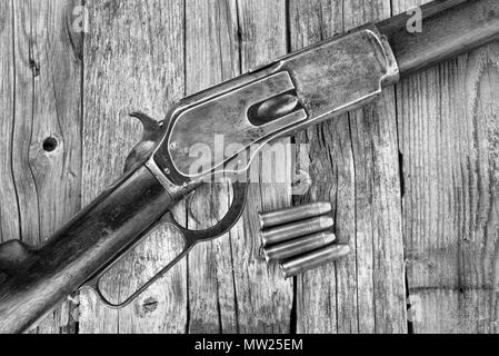 Antique 1876 lever action cowboy rifle in black and white. Stock Photo