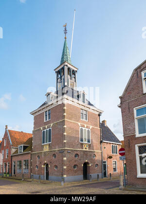 Old waag, weigh house, in historic town of Makkum, Friesland, Netherlands Stock Photo