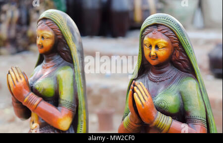 Glazed terracotta figurines of two women, in Namaste posture, on display at Shilparamam arts and crafts village, Hyderabad, Telangana, India. Stock Photo