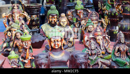 Terracotta statuettes of Buddha and Ganesha, and an assortment of other figurines on display at Shilparamam arts and crafts village, Hyderabad, India. Stock Photo