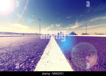 road travel transportation.Asphalt in perspective and sunset. Stock Photo