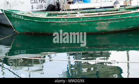 small fishing boats moored in port of many colors Stock Photo