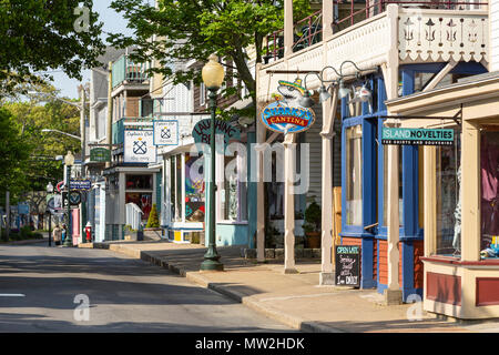 Shops and restaurants line Circuit Avenue, the main shopping district in downtown Oak Bluffs, Massachusetts on Martha's Vineyard. Stock Photo