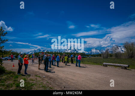 YELLOWSTONE, MONTANA, USA MAY 24, 2018: Unidentified people most them photographers taking pictures and enjoying the landscape of Grand Teton National Park, Wyoming Stock Photo