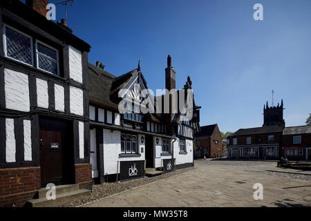 Sunny day Cheshire East market town Sandbach, The Cobbles Market Square Ye Olde Black Bear, inn pub thatched roof 400 year old, Grade II* Listed Build Stock Photo