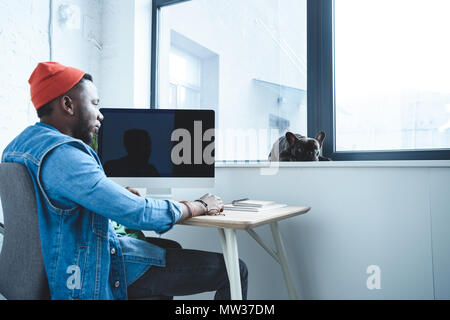 young man lying on the windowsill wearing headphones technology Stock ...