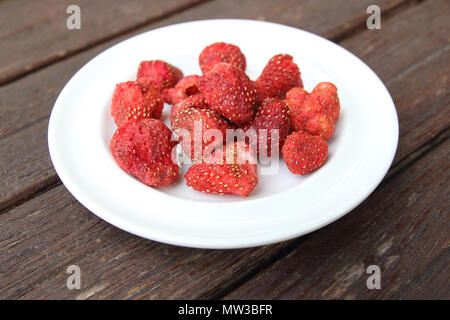 Freeze dired strawberries on wooden tabel Stock Photo