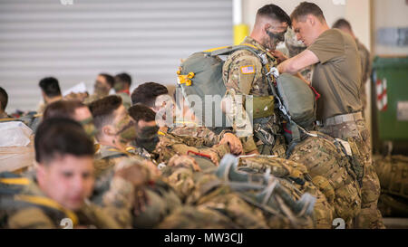 U.S. Army Soldiers from the 173rd Airborne Brigade, 2nd Battalion, 503rd Infantry Regiment, prepare for a jump at Aviano Air Base, Italy, during Exercise Saber Junction 17, April 27, 2017. The Exercise involves nearly 4,500 participants from a variety of military units from Albania, Bulgaria, Georgia, Italy, Kosovo, Lithuania, Macedonia, Poland, Romania, Slovenia, Ukraine, the United Kingdom and the United States. Stock Photo