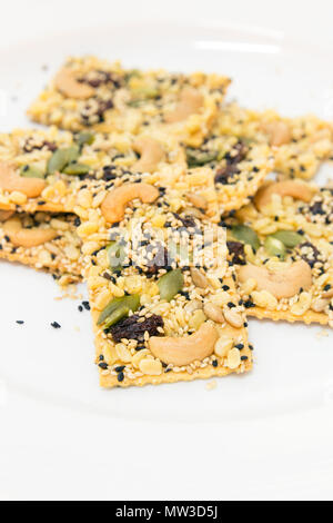 Cereal cracker on white dish Stock Photo
