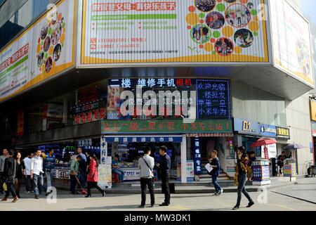 SHENZHEN, CHINA - APRIL 3: SEG famous electronic market in HuaQiangBei road. People walks in front of main entrance on April 3rd, 2018. Stock Photo