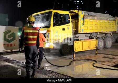 SHENZHEN, CHINA - APRIL 3: construction field in Futian district. Washing off truck in the night on April 3rd, 2018. Stock Photo