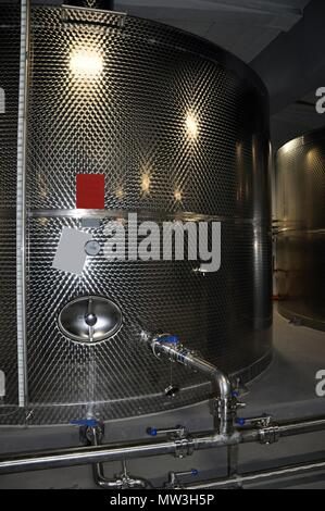 Large fermenter steel tanks, wine modern factory equipment, front view Stock Photo